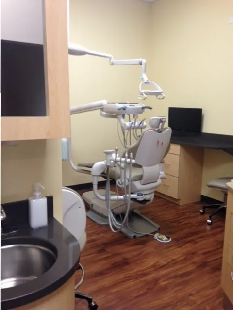 Dental patient chair at {PRACTICE_NAME}